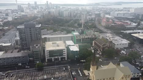 drone shot from the church to sky city and auckland view