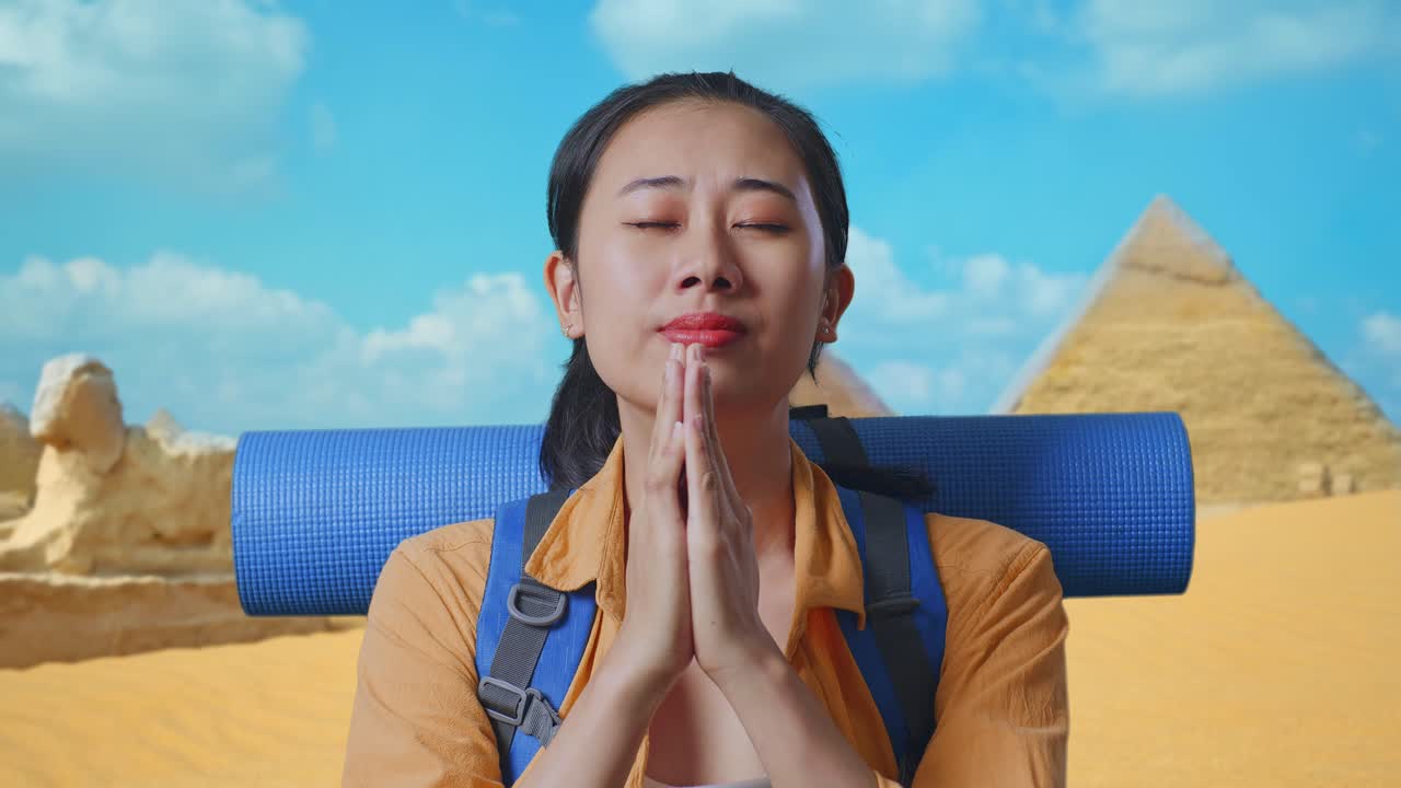 Close Up Of Asian Female Hiker With Mountaineering Backpack Pray For Something While Traveling In Pyramid Of Giza