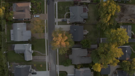 straight down overhead view of houses with a slow move up the street