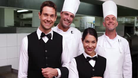 Happy-restaurant-staff-smiling-at-camera