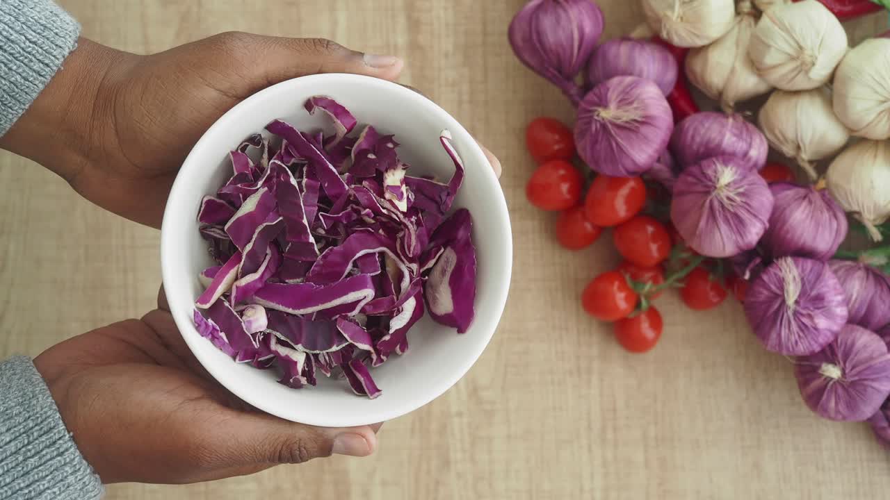Preparing Red Cabbage Salad with Other Ingredients