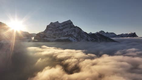 rautispitz with morning sun above clouds, glarus nord, netstal, molis, switzerland