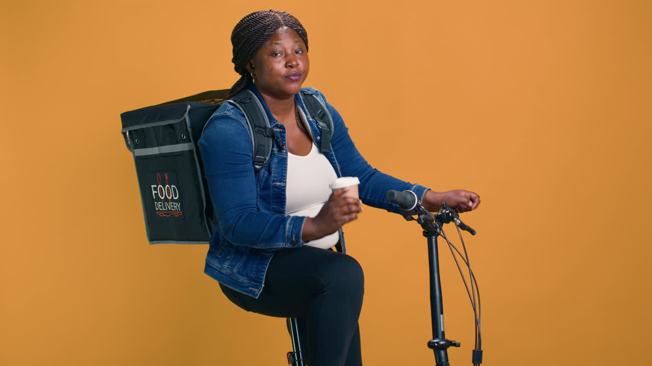 Courier Takes Coffee Break On Bicycle
