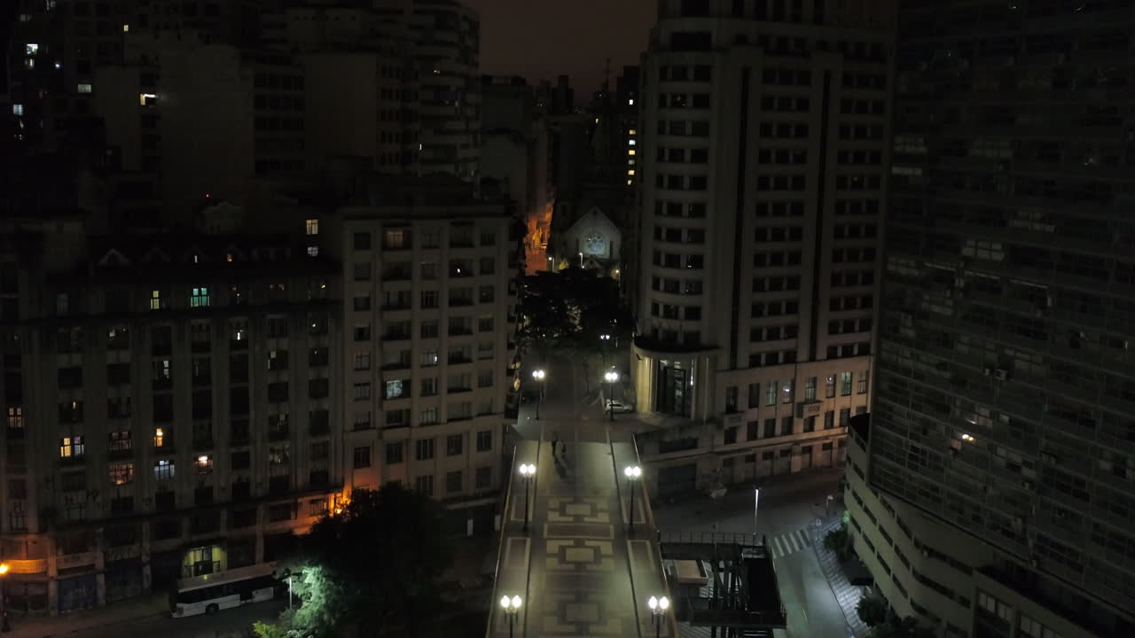 Aerial view of Santa Efigenia viaduct at night with no one in the street, at night, Sao Paulo downtown, Brazil