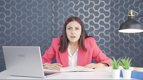 Angry-young-business-woman-looking-at-camera.