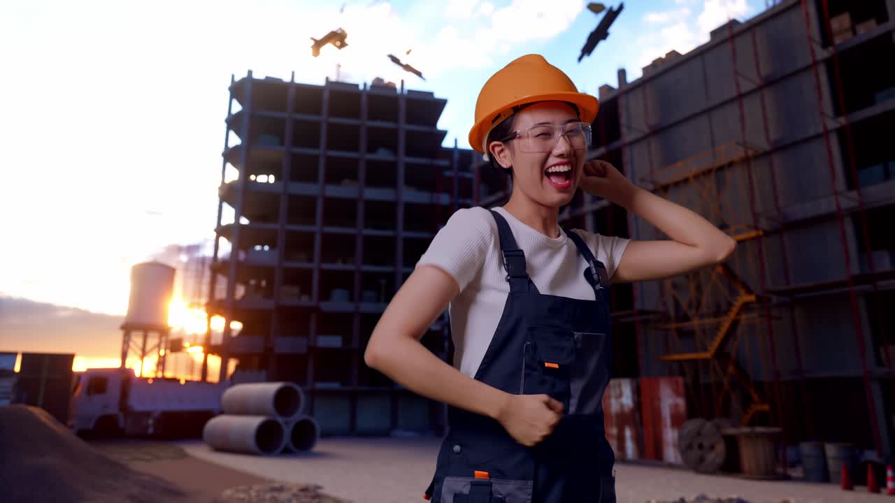 Asian Woman Worker Wearing Goggles And Safety Helmet Dancing While Standing At Construction Site