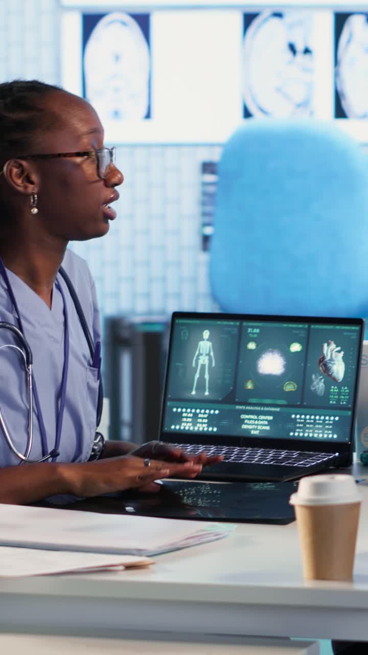 Vertical Video Nurse and patients reviewing diagnostic results in medical cabinet
