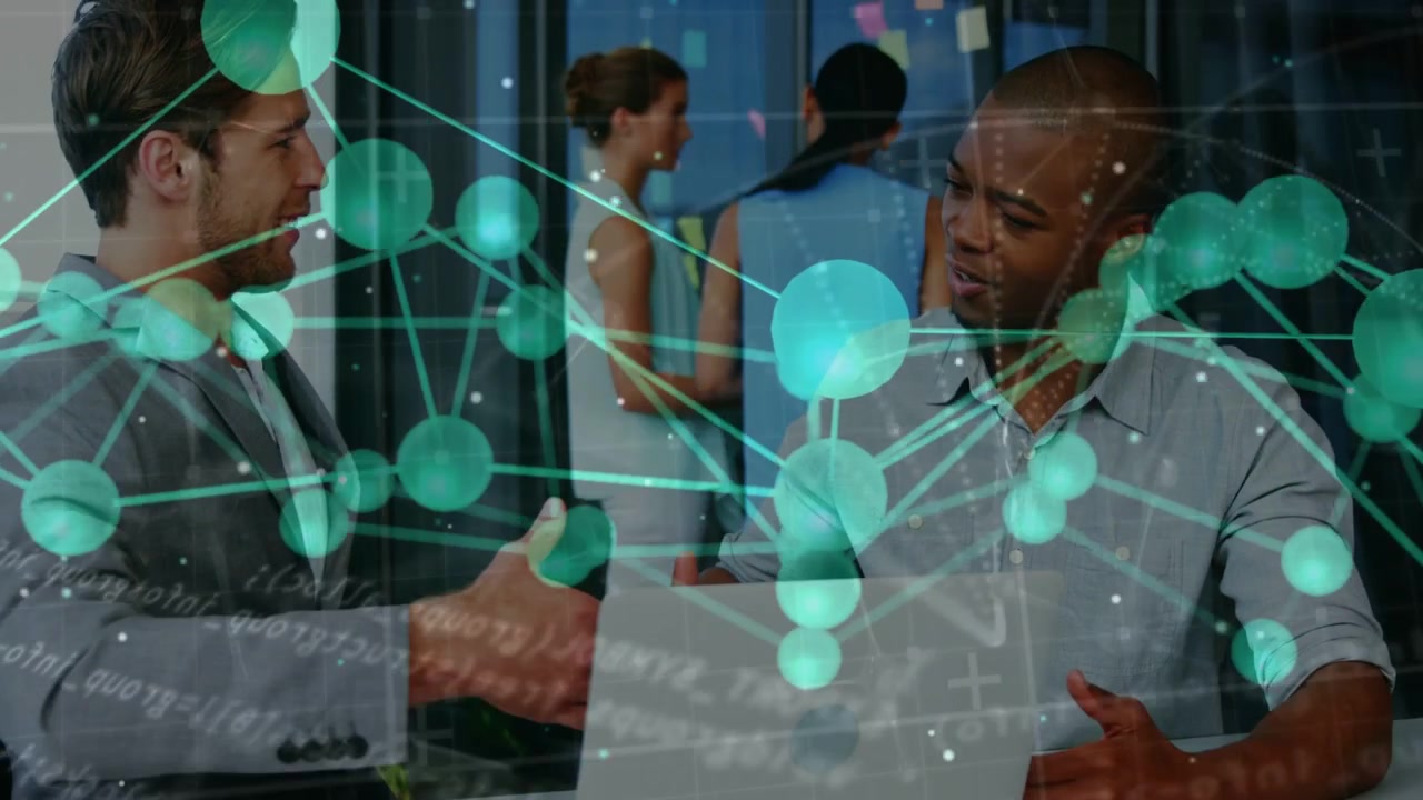Teal overlay covering frame, two men leaning over laptop, gesturing, agreeing on business plan