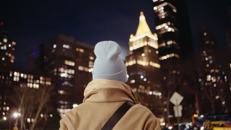 Person walking in New York City at night