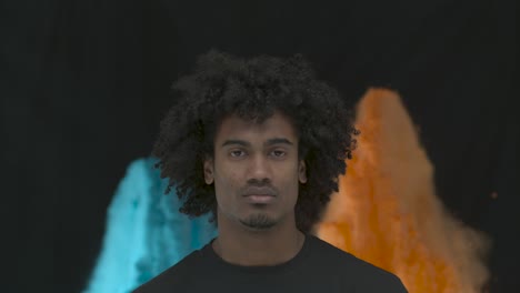 man in color powder explosion slow motion