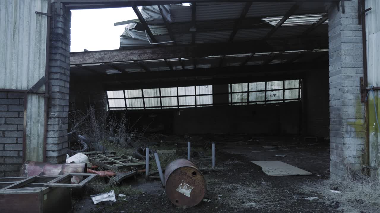 A Rusty Container And Other Discarded Things In A Bricked Abandoned Farm Building In North Ireland. -medium shot