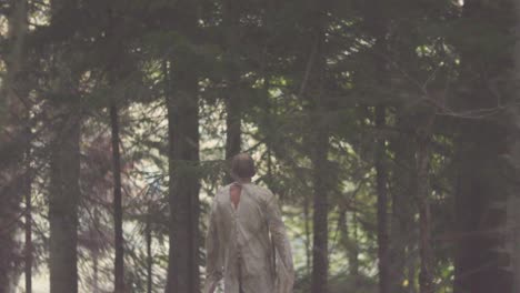 man walking in a forest