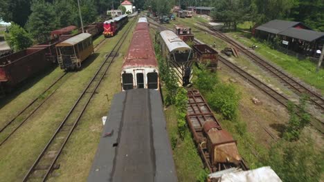 dynamic drone shot of an vintage rusty railway cars