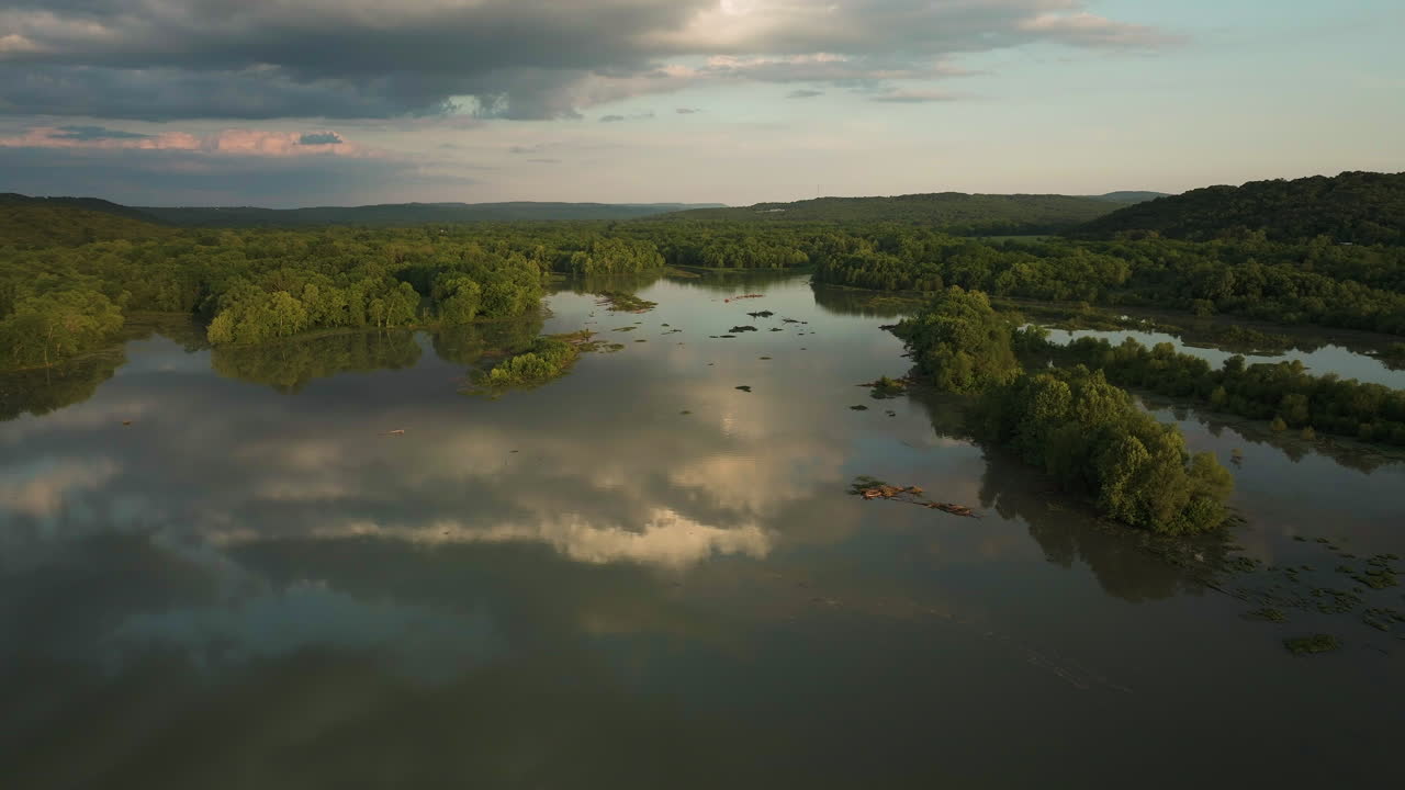 Stunning cloud reflections on calm Lake Sequoyah's surface
