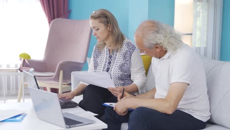 Married-couple-working-in-home-office.