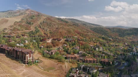 aerial drone footage of housing and condos, in the fall, at the base of mount werner in steamboat springs colorado