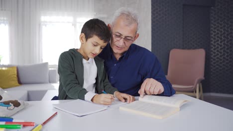father helping his son with homework.
