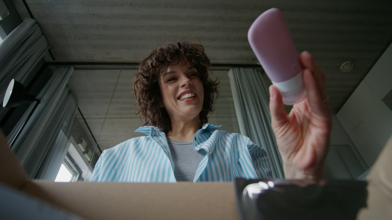 Woman Unboxing a Small Gift