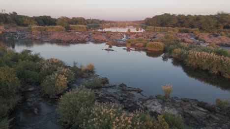 Wide-view-of-the-Komati-River-during-Golden-Hour-in-the-early-morning,-aerial