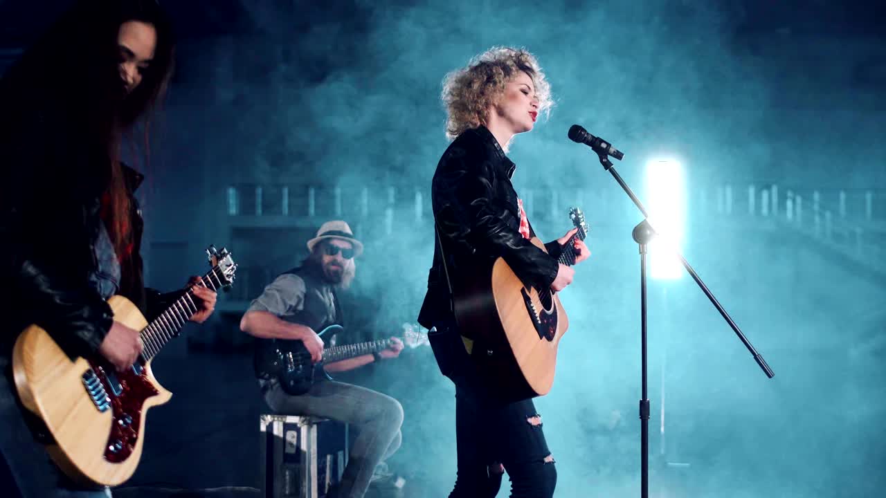 Female performer playing the guitar