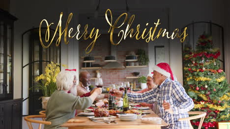 Animation-of-merry-christmas-text-over-diverse-senior-friends-at-christmas-dinner-at-home