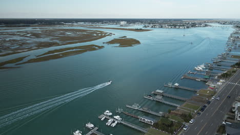 aerial-tracking-speed-boat-Wrightsville-Beach,-North-Carolina