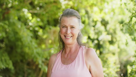 Senior-Caucasian-woman-smiles-brightly-outdoors