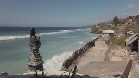 still shot of bali indonesia beautiful sandy beach with ocean blue background in windy evening