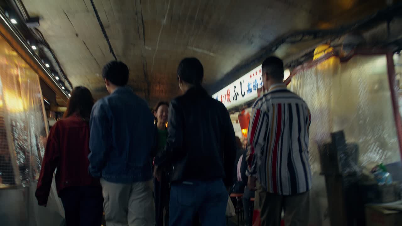 People Walking Through an Underpass Market