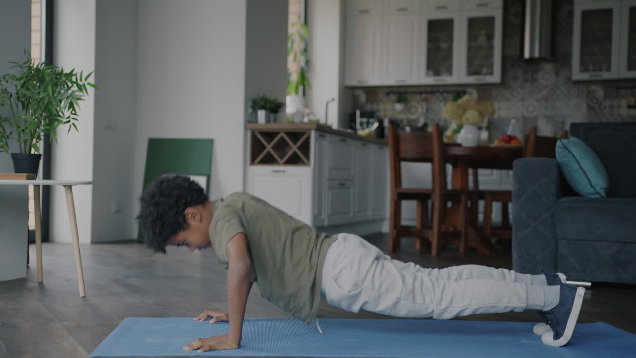 Child Doing Push-Ups at Home