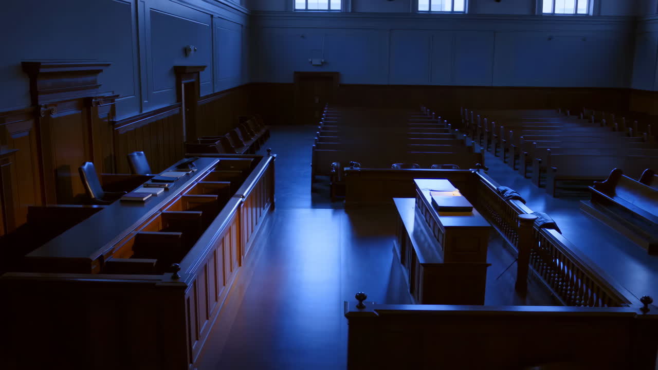 An Empty and Solemn Courtroom Bathed in Blue Light