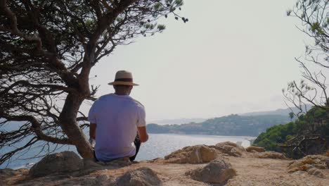 young man wide shot landscape