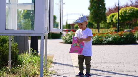 outdoor in the park walking small boy. weekend family walk.
