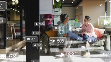 animation of notification bars over diverse female coworkers discussing reports on digital tablet