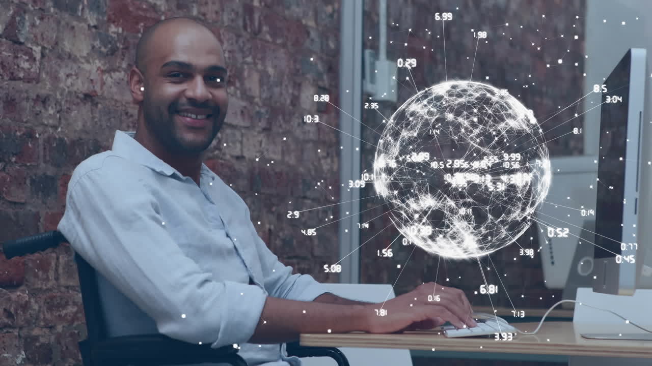 Animazione di un globo sopra un uomo disabile di origine mista seduto in sedia a rotelle che usa il computer