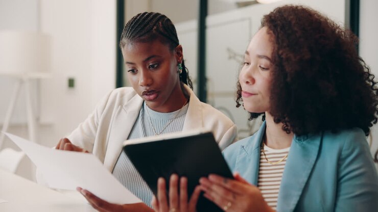 Two Businesswomen Working Together in an Office