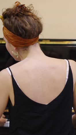 Woman with Headband Playing Piano