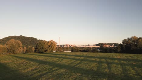 industrial landscape at sunset with river reflection