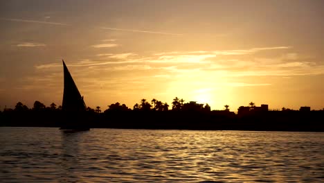 nile sail boat on the nile in luxor at sunset in the beautiful and historic egypt