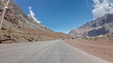 pov shot driving through the mountain valley in the remote mendoza, argentina