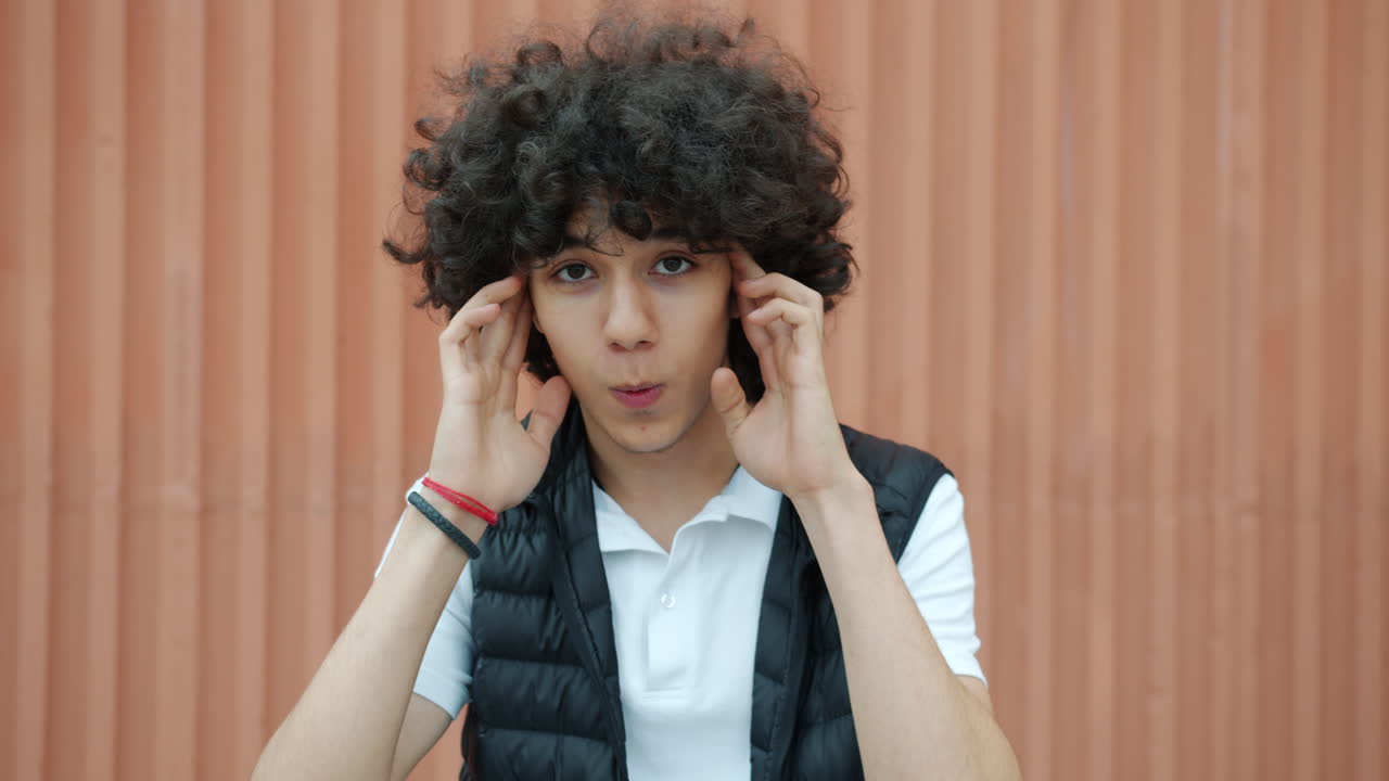 Teenage Boy Expressing Confusion or Thoughtfulness