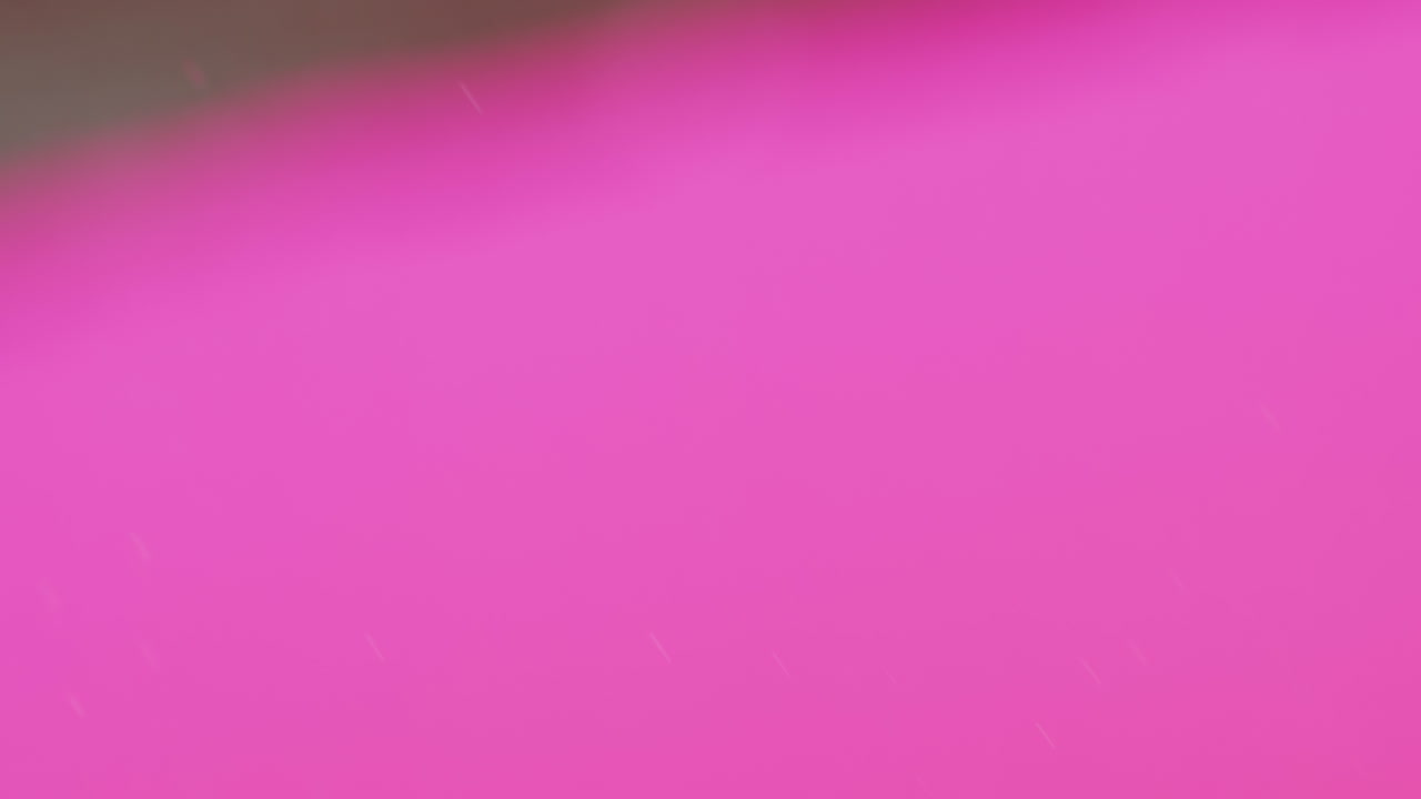 animación de burbujas que se mueven sobre un fondo rosa con espacio de copia