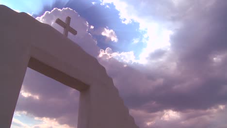 a christian cross glows against a heavenly sky 2