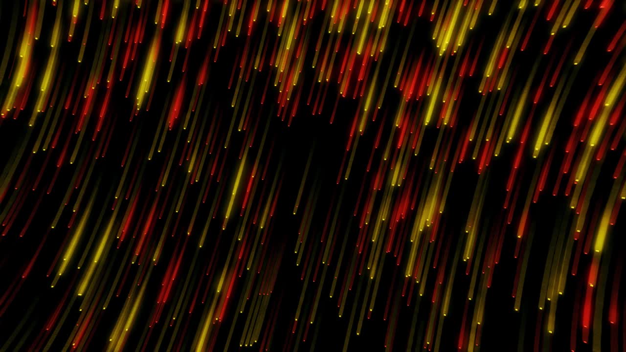 Yellow and red glittering particles fall from corner to corner against a black background. Background abstract animation.
