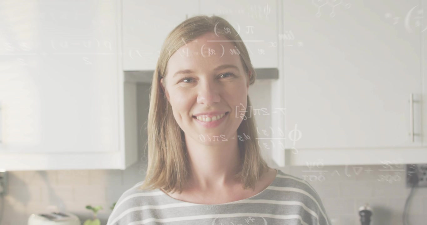 Adult woman in kitchen smiling as floating math equations appearing enhancing education engagement