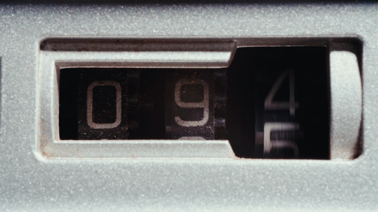 Macro of Retro Tape Counter with Rotating Digit Wheels