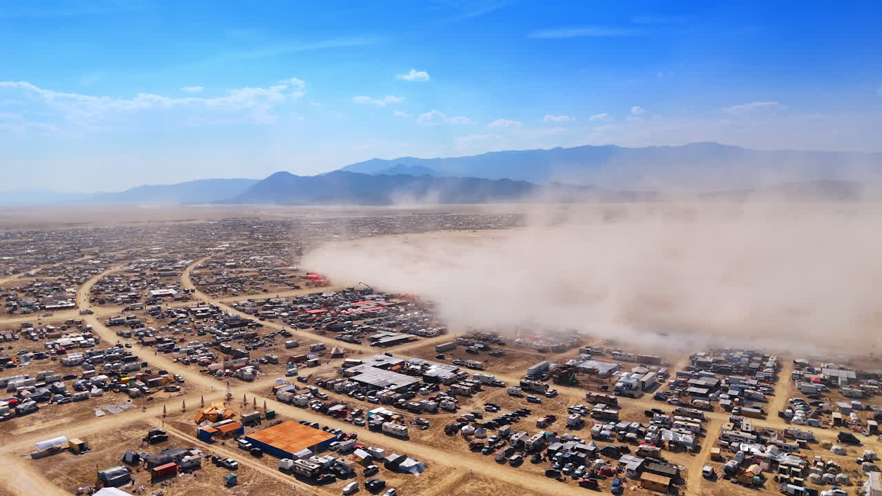 Dust Storm Over Burning Man City. Drone view capturing a dust storm moving across the playa