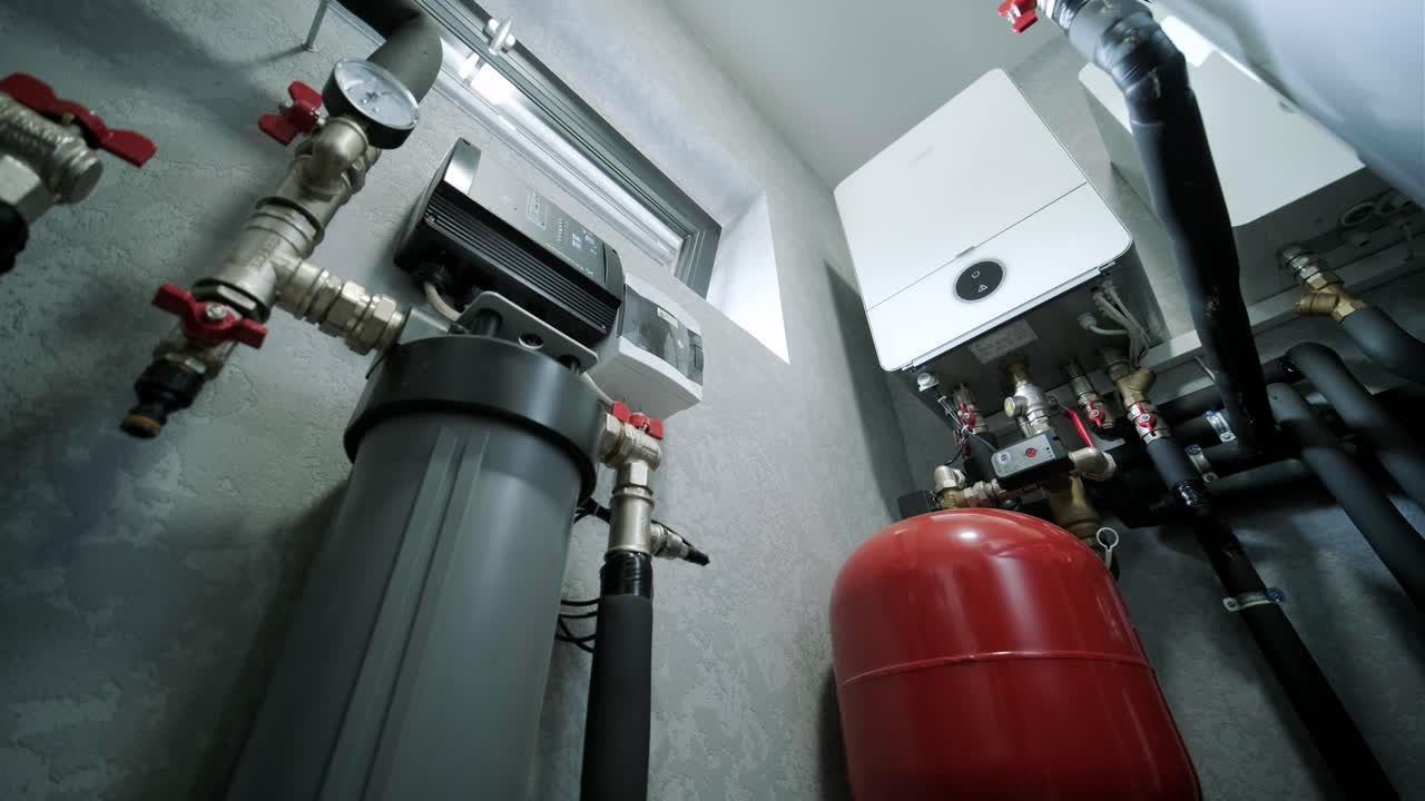 House boiler room interior with modern water heating system