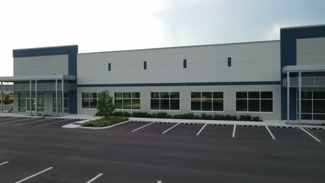 modern commercial building with empty parking lot
