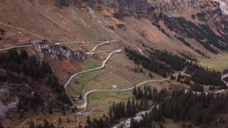 Aerial-shot-of-a-rocky-mountain-landscape-criss-crossed-by-winding-road